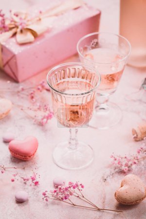 Rose sparkling wine, french macarons and box of chocolates for Valentime, mothers day or birthday